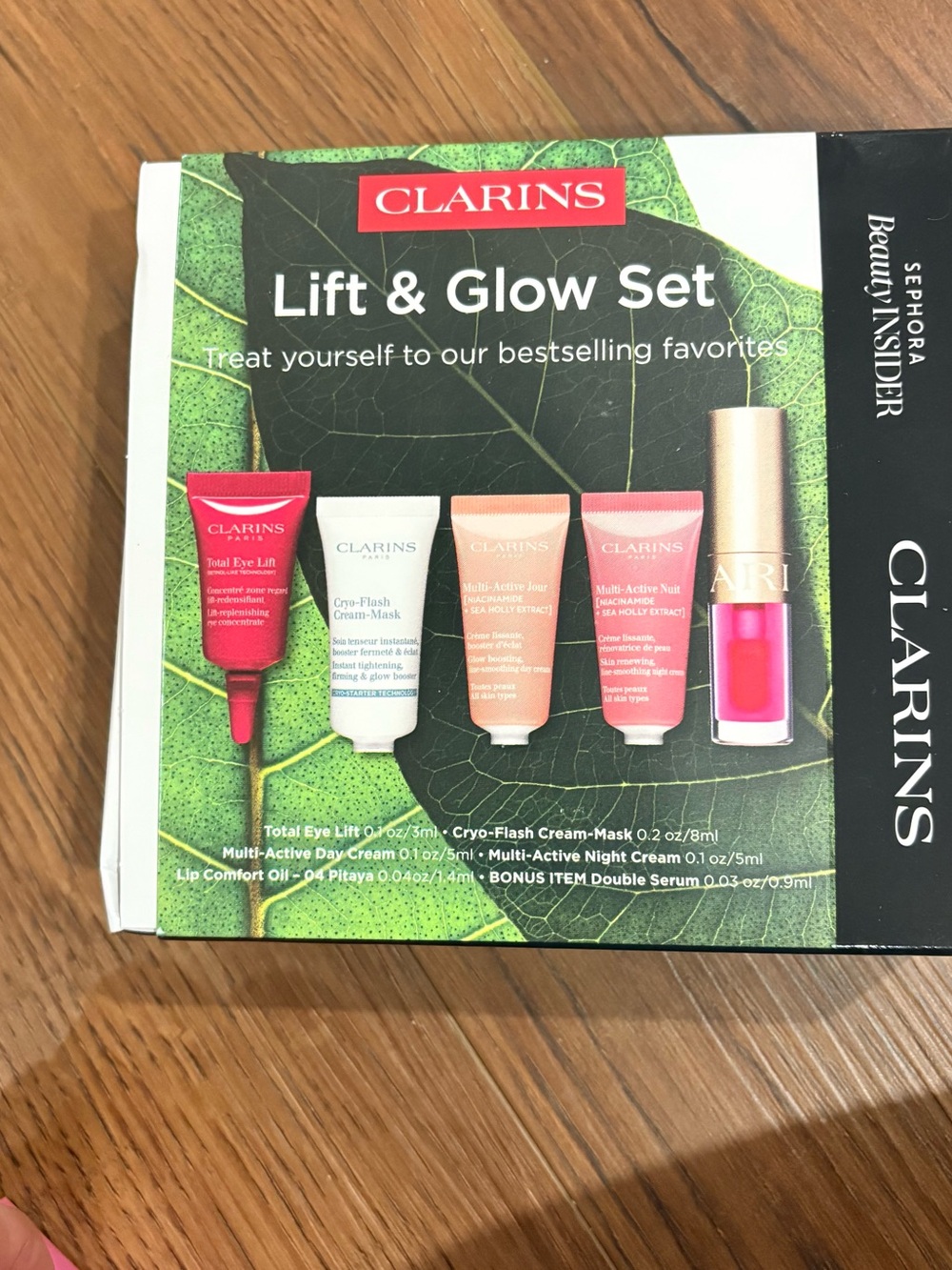 Clarins Lift & Glow Set — green, red, pink, white, gold